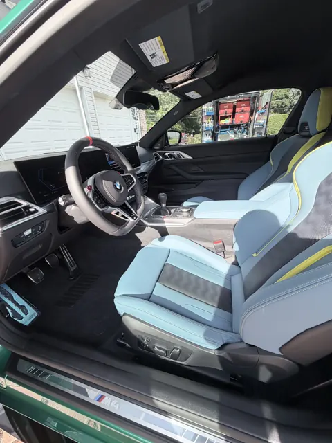Wide view of a cabin with blue and yellow upholstery