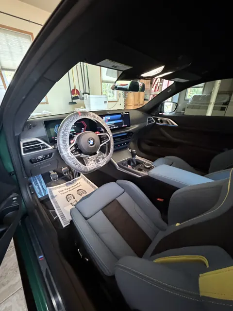Front cabin with dark upholstery and center console