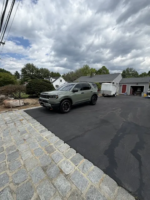 Light-colored SUV in an outdoor parking lot