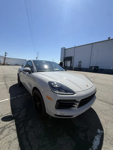 Front view of a white SUV in a parking lot